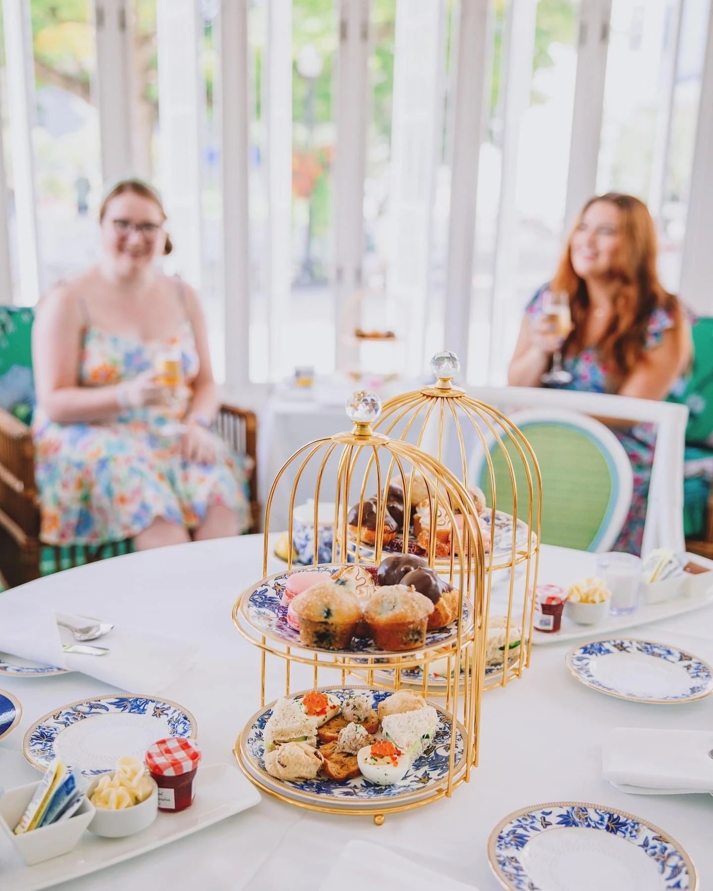 Group enjoying afternoon tea at a table
