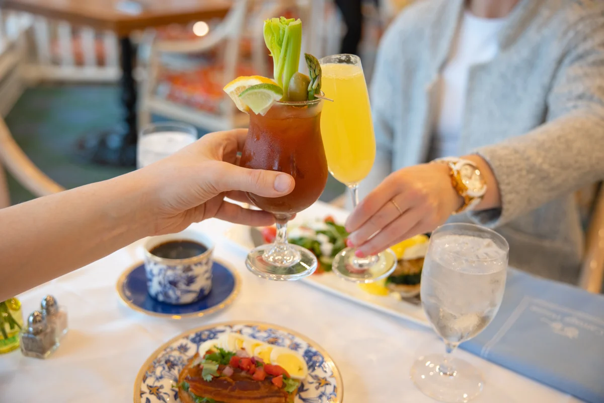 Guest holding a drink at brunch